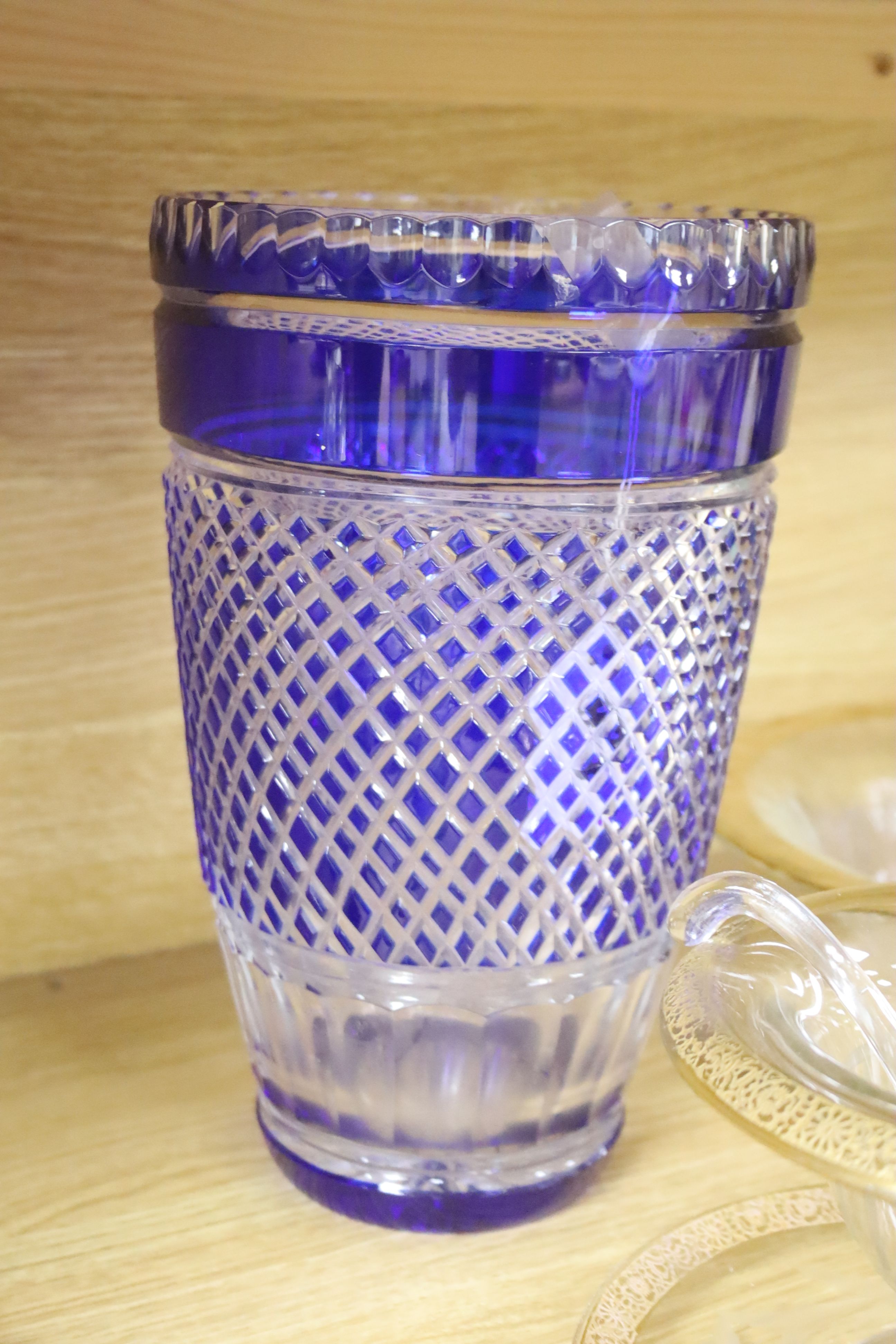 A blue flash cut glass vase, height 27cm, and gold edged Continental glassware